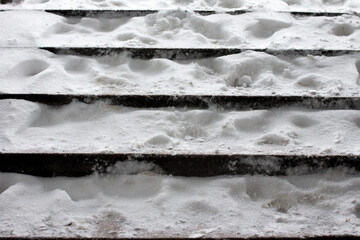 City stairs covered with white snow. Winter blizzard - obrazy, fototapety, plakaty