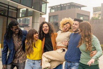 multiracial group of friends walking and having fun together, millennials people smiling and...