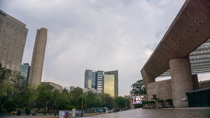 National Auditorium entrance and cityscape under a cloudy sky