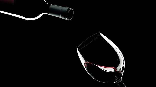 Red wine is poured from bottle into a glass with splash on black background