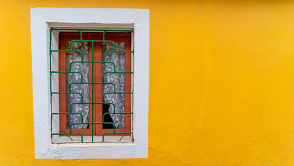 Fototapeta na wymiar Clean window of house in fontainhas Panjim Goa.