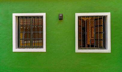 Green wall of house in fontainhas Panjim Goa. - obrazy, fototapety, plakaty