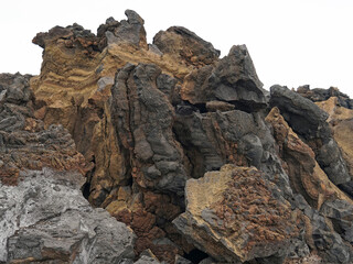 Colourful volcanic stone or rock from fresh volcanic magma after eruption, Mount Etna, Sicily, Italy