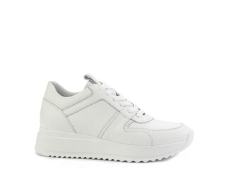 White classic leather trainers. Casual women's style. White lacing and white rubber soles. Isolated...