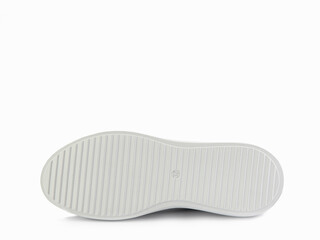 White leather sneakers with black details. Casual women's style. White lacing and white rubber soles. Isolated close-up on white background. Shoe sole view. Fashion shoes.
