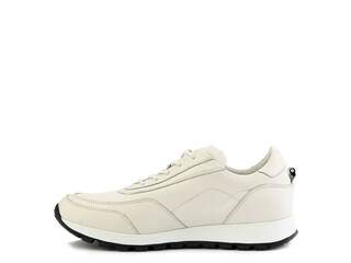 Stylish ivory women trainers with white lacing and white and black rubber soles. Isolated close-up on white background. Left side view. Casual women's style.