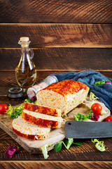 American meatloaf with chicken meat, pumpkin and green peas. Baked minced chicken meat