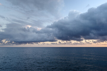 Cumulus clouds hovering over the Ligurian sea, Italy