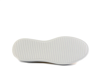 Bright yellow leather sneakers. Casual women's style. White lacing and white rubber soles. Isolated close-up on white background. Shoe sole view. Fashion shoes.