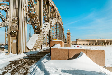 Winter landscape of Bolsheokhtinsky Bridge in St. Petersburg on a sunny snowy day. St Petersburg, Russia - 25 Feb 2021