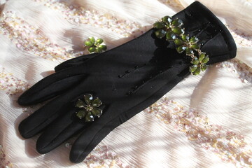 black glove with jewelry 