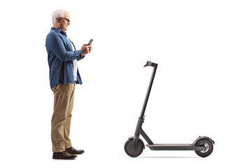 Fototapeta na wymiar Full length profile shot of a mature man renting an electric scooter through a mobile phone application