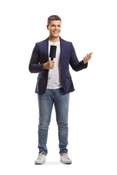 Full length portrait of male reporter holding a microphone and gesturing with hand