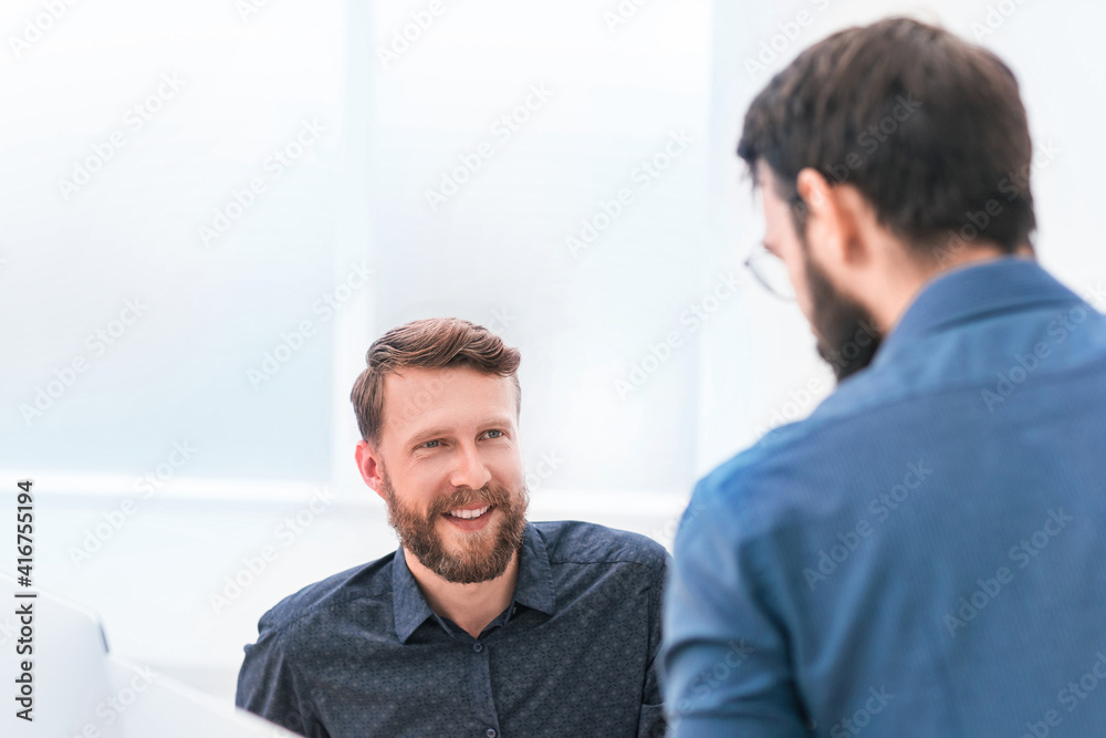 Wall mural two successful business people on an office background