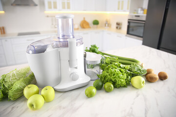 Modern juicer, fresh vegetables and fruits on table in kitchen