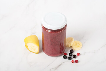 baby berry puree with banana in a jar