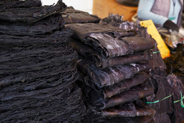 Fototapeta na wymiar Dried seaweed stacked in a traditional market