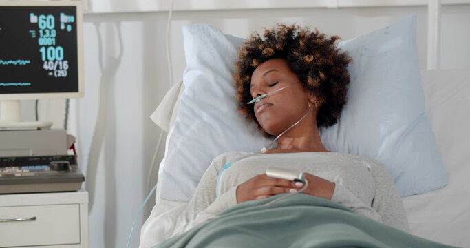 African Sad Woman Lying With Fever On Bed In Hospital Indoor