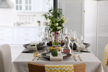 Beautiful Easter table setting with festive decor indoors