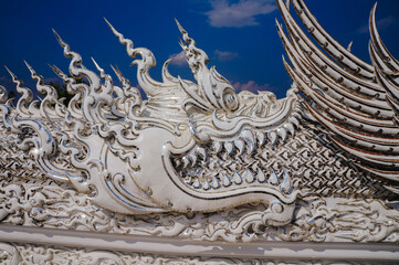 Fototapeta premium Ancient animal pattern texture pattern in Rong Khun Temple, Chiang Rai, Thailand