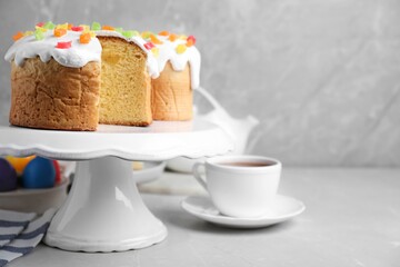 Easter cakes on light grey marble table. Space for text