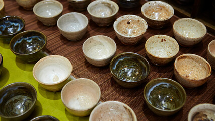 Various porcelain tea cups on the table