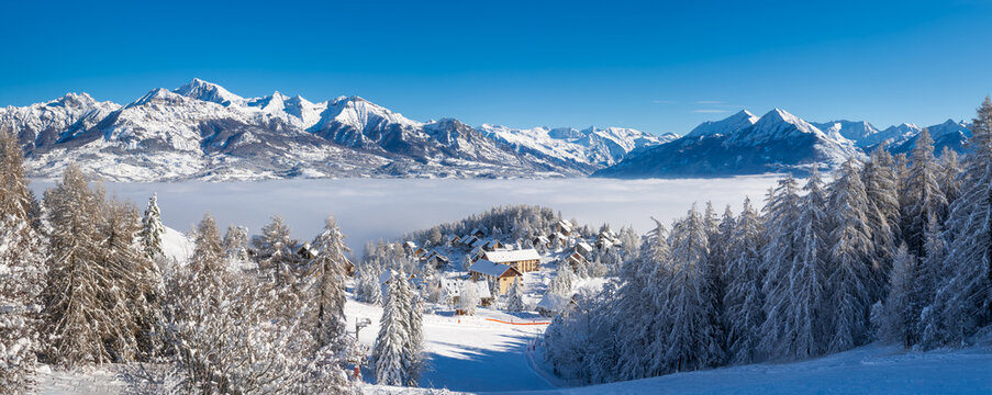 Laye winter ski resort in Champsaur covered in fresh snow with panoramic view on the mountains of the Ecrins National Park. French Alps. Hautes-Alpes, France - Powered by Adobe