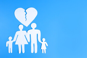 paper family and a cracked heart. The concept of divorce, family preservation