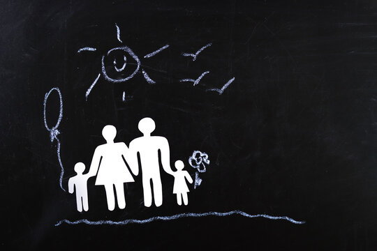 happy Paper family on the blackboard - home concept