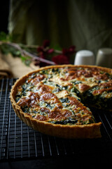 Delicious Homemade cheesy spinach quiche pie.