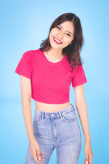 Obraz premium Portrait of a beautiful woman Asian teenagers With a confident, happy face, a confident, beautiful woman on a blue background.