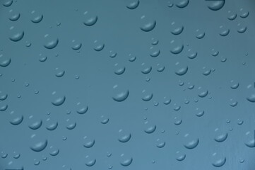 Beautiful abstract shape water droplets on blue sky background Suitable for advertising or filling in other messages.
