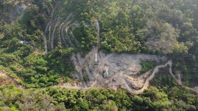 Drone View Look Down Powerline Of Deforest Jungle