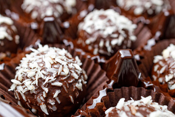 close-up of chocolates with coconut on top