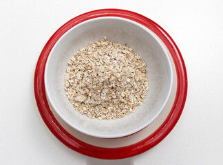 Dry organic oats in bowl