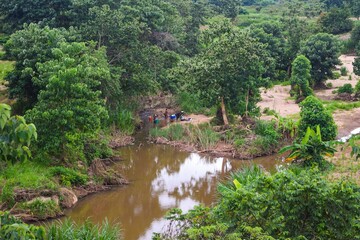 Obraz premium A fresh water river in the forest in rural Malawi