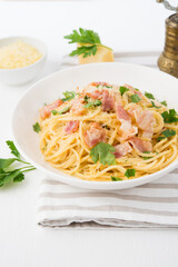Spaghetti carbonara with bacon-traditional Italian dish, top view