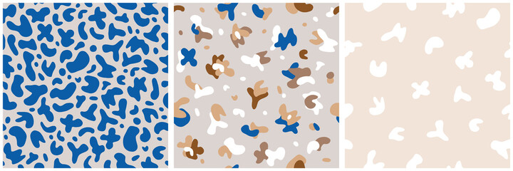 Three modern abstract seamless backgrounds with colorful spots in blue, beige and brown tones