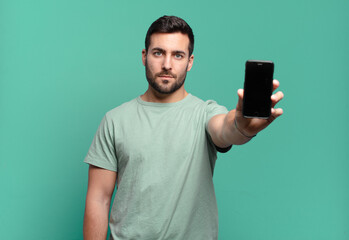 young handsome man using his cell