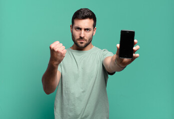 young handsome man using his cell