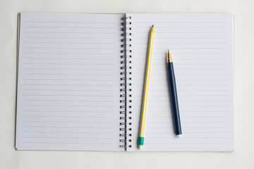 Writing and planning, notebook, pencil and pen, top view, copy space