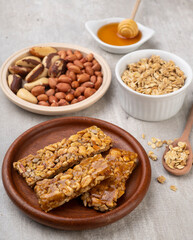 Homemade cereal bars with nuts, muesli and honey