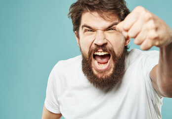 aggression stress man with a beard emotions indignant look fist