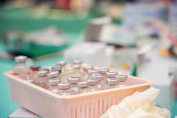 Glass bottles with liquid medicine and dose of serum in clinic hospital. Healthcare and medical for corona virus (Covid19) background concept.