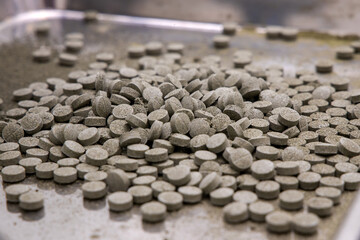 Pills heap in drugs manufacturing laboratory. 