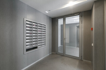 mailboxes in the lobby of an apartment building