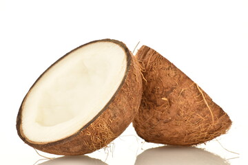 Two halves of ripe organic coconut, close-up, isolated on white.