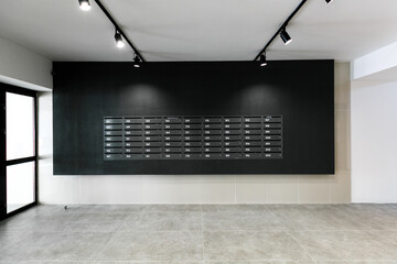 mailboxes in the lobby of an apartment building
