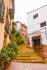 Vilafames, Castellon province, Valencian Community, Spain. One of Spain’s Most Beautiful Towns in the country. Historic medieval flowered street and traditional architecture. 