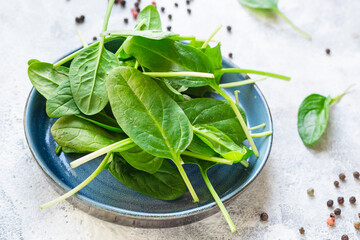 spinach fresh green petals leaves for cooking healthy food portion on the table cooking meal snack outdoor top view copy space for text food background rustic image keto or paleo diet vegan or vegetar